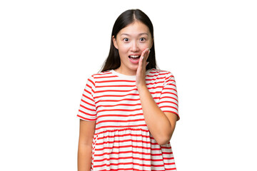 Young Asian woman over isolated background with phone in victory position