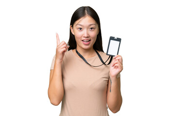 Young Asian woman with ID card over isolated background pointing up a great idea
