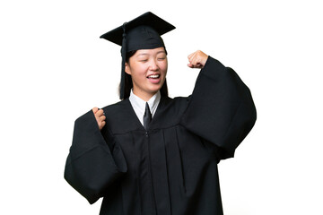 Young university graduate Asian woman over isolated background celebrating a victory