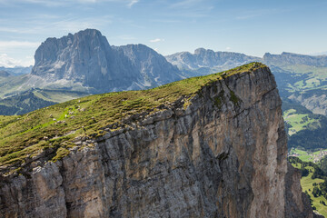 wide view of an alpine valley among the Dolomites in Val Gardena (Sassolungo mount in the background)