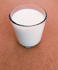 Glass of milk fresh full with calcium and vitamins protein and lactose pure white dairy-milk drink...