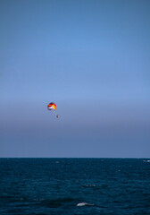 people in the sky on a parachute