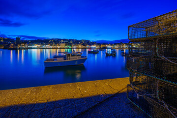 Evening view of lobster traps and the harbor, St Ives