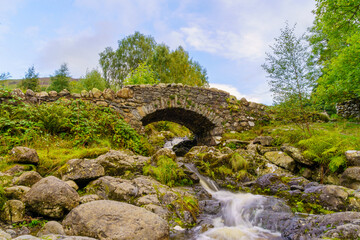 Fototapeta na wymiar Ashness Bridge, traditional stone-built bridge, the Lake District