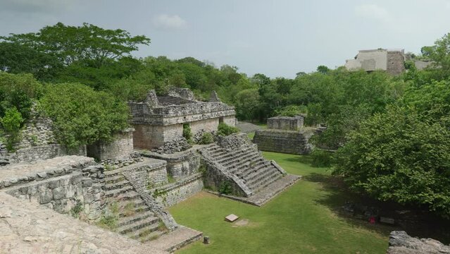 Drone view of the Ek Balam archaeological site surrounded by green trees in  Mexico