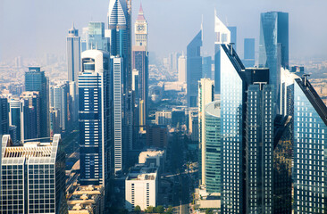 Obraz na płótnie Canvas Dubai city view at sunset. Famous skyscrapers along the Sheik Zayed Road