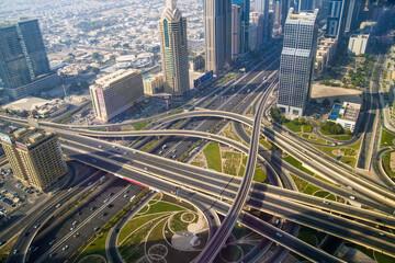 Fototapeta na wymiar Dubai city view, Sheik Zayed Road main junction with cars and tube line
