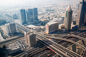 Fototapeta na wymiar Dubai city view, Sheik Zayed Road main junction with cars and tube line