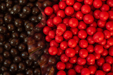 many colored marmalade candies laid out on a flat surface; dessert for the holiday; sweet gifts for children; texture and background with small candies;
peanuts in chocolate