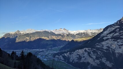 Swiss Alps view from Mount Pilatus, Lucerne Switzerland. Mounts with white gray clouds sky