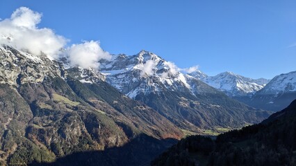 Swiss Alps view from Mount Pilatus, Lucerne Switzerland. Mounts with white gray clouds sky