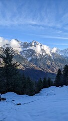 Fototapeta na wymiar Swiss Alps view from Mount Pilatus, Lucerne Switzerland. Mounts with white gray clouds sky