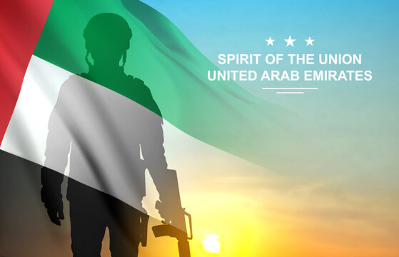Silhouette of a solider on a background of sunset and UAE flag. UAE national holidays concept. National Day, Commemoration Day