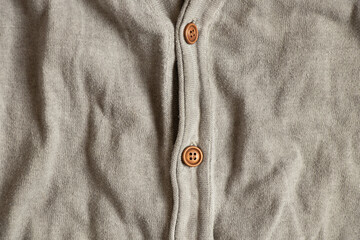 Men's gray stylish jacket with buttons as a background close-up, stylish