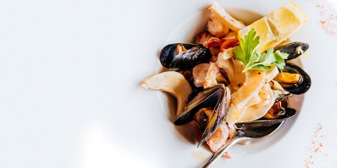 Traditional Italian food. Sea salad with salmoriglio sauce. Bergamo, Lombardy, Italy, Europe