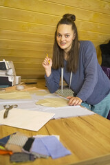 A professional fashion designer creates a new collection of clothes.