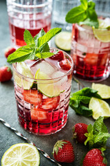 Summer  cold drink (juice, cocktail, fruit tea) with strawberries, selective focus