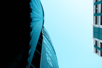 Abstract, metal exterior onbuilding with clear sky.