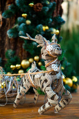 Fototapeta na wymiar Creative decoration with Christmas toys,fabulous reindeer with a harness,handmade