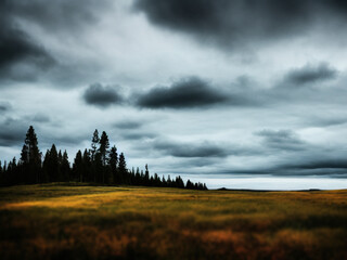 Dark skyes looming over a beautiful Scandinavian landscape, generated by A.I.