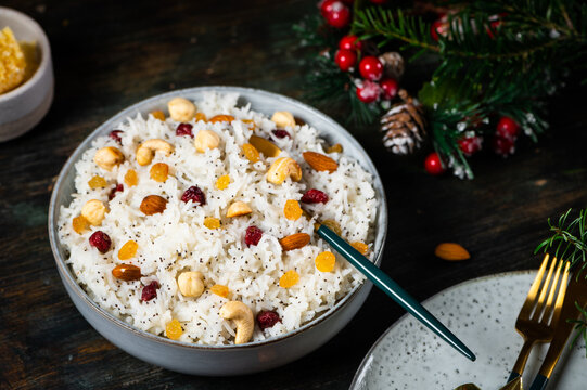 Traditional Christmas kutia. Boiled rice porridge. traditional Slavic holiday ritual dish. Sweet pilaf with nuts. Kutya Ukrainian. Orthodox christmas