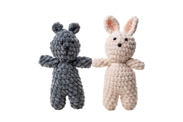 knitted toys with threads isolated on transparent background png . Bear and hare hold hands....