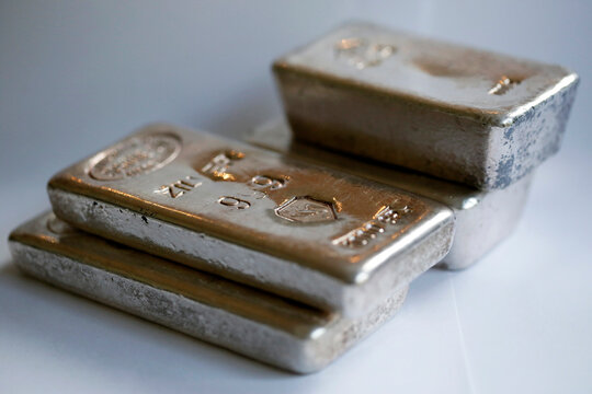 Silver bars of 1 kilo each isolated at at grey colored background