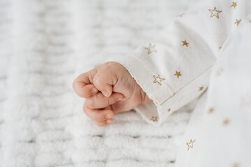 tiny newborn baby hand close up detail 