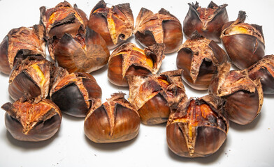 Traditional Portuguese chestnut (Castanea sativa) roasted in selective focus and closeup. Christmas nuts 