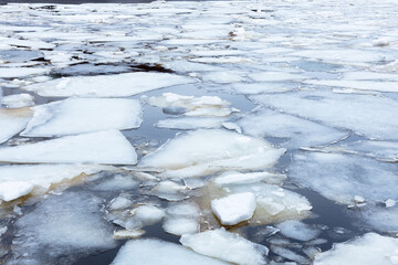 the river breaks off the ice, the beginning of the ice drift, selective focus