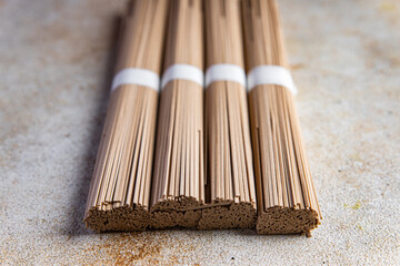 buckwheat noodles soba raw product Asian dish fresh delicious snack healthy meal food snack on the table copy space food background rustic top view keto or paleo diet veggie vegan or vegetarian food