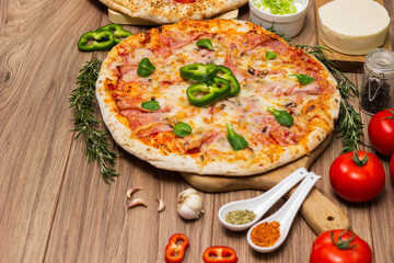 Pepperoni pizza and pizza Capricciosa with mozzarella cheese, ham, tomato sauce, salami, mushroom, pepper, spices and fresh basil