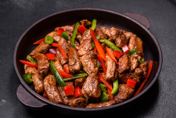 Delicious Asian teriyaki meat with red and green bell peppers