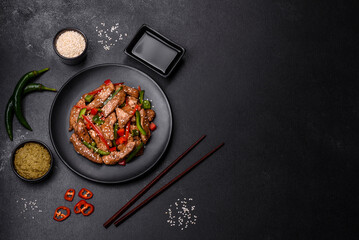 Delicious Asian teriyaki meat with red and green bell peppers
