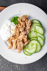 tuna salad, cucumber and yogurt or sour cream fresh delicious snack healthy meal food snack on the table copy space food background rustic top view keto or paleo diet veggie vegan or vegetarian food 