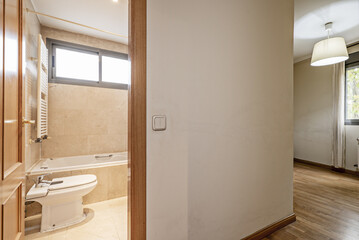 Empty double bedroom with full bathroom en suite with marble tiling and French oak parquet flooring in the room