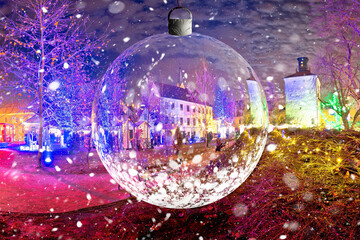 Zagreb historic upper town advent evening snow view through glass christmas ball