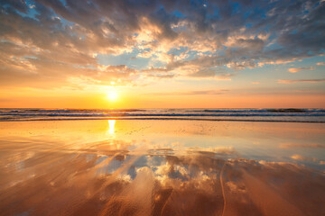 Beach sunrise over the tropical sea sand and waves