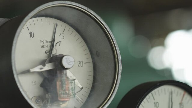 Multiple Manometers measure system pressure in a production facility. Pressure gauges monitor system pressure in production