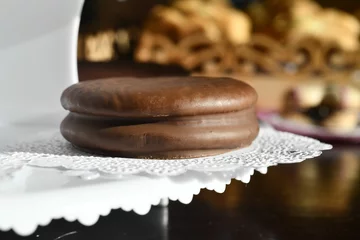Deurstickers Closeup of Choco pie against a blurred background © Leon Colon Ortega/Wirestock Creators