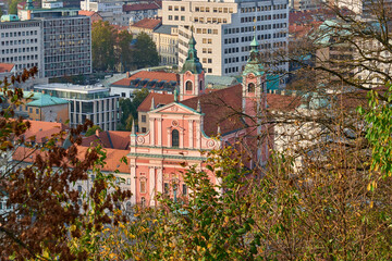 Detail of Franciscan Church of the Annunciation on city buildings background in Ljubljana, Slovenia, aerial view