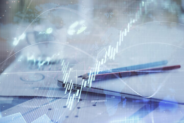 Forex graph hologram on table with computer background. Double exposure. Concept of financial markets.