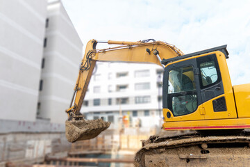 Construction excavator at work on construction site.Project in progress.