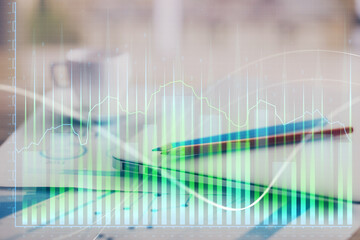 Obraz premium Forex graph hologram on table with computer background. Double exposure. Concept of financial markets.