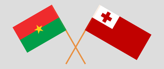 Crossed flags of Burkina Faso and Tonga. Official colors. Correct proportion