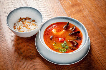 seafood soup on the wooden background