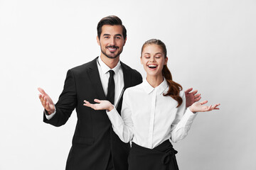 Man and woman smile with teeth business in business attire looking into camera on white insulated background hands up. Stylish business concept paired between employees startup copy place