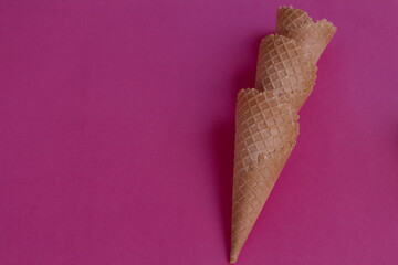 three ice cream cones stacked vertically on a pink background