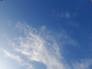 Blue sky with puffy clouds background. Natural background 