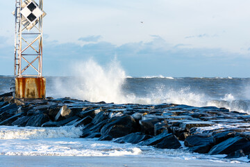 Strong waves crash against the Ocean City Inlet jetty after Blizzard Kenan.